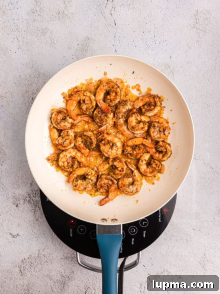 Vibrant Shrimp Pesto Pasta 7 Shrimp cooking in a pot for Shrimp Pesto Pasta