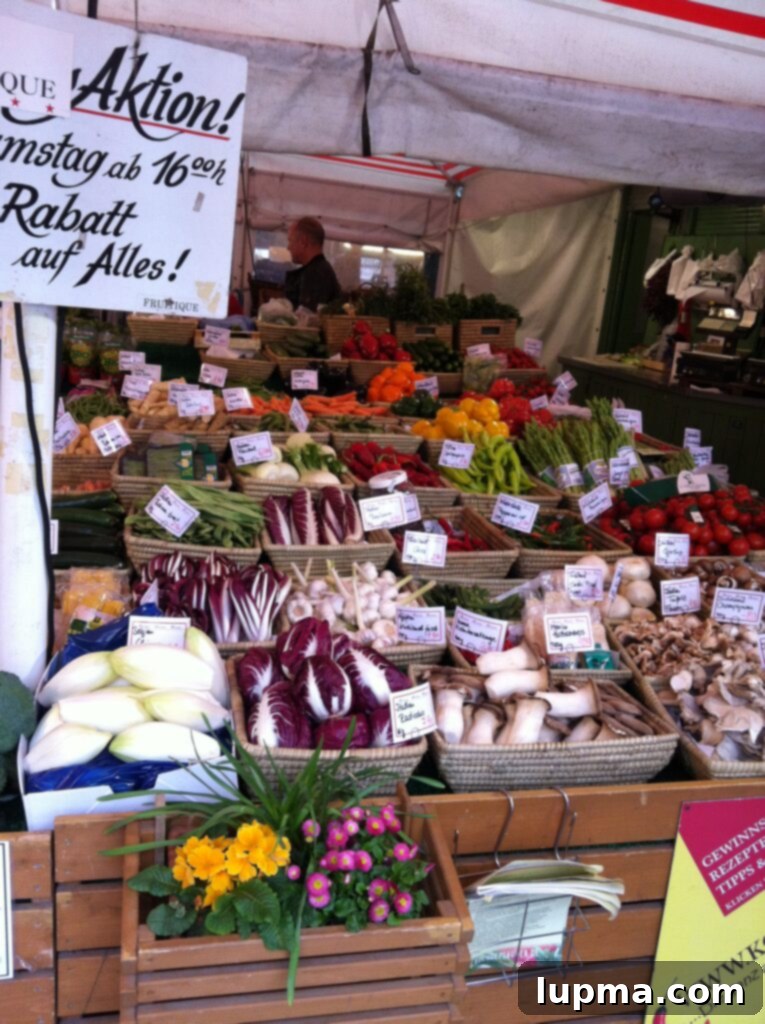 A vibrant display of fresh vegetables at a market stall in Munich, Germany