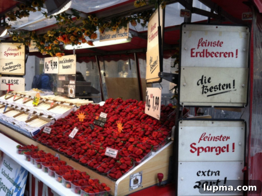 Close-up of fresh, ripe strawberries at a market stall