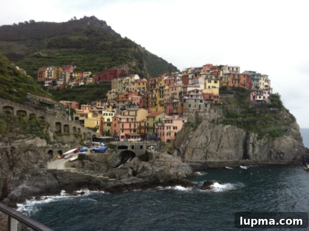 Cinque Terre and Santa Margherita Italy Coastal Charms 2 Panoramic view of colorful houses nestled along the coast of Cinque Terre, Italy
