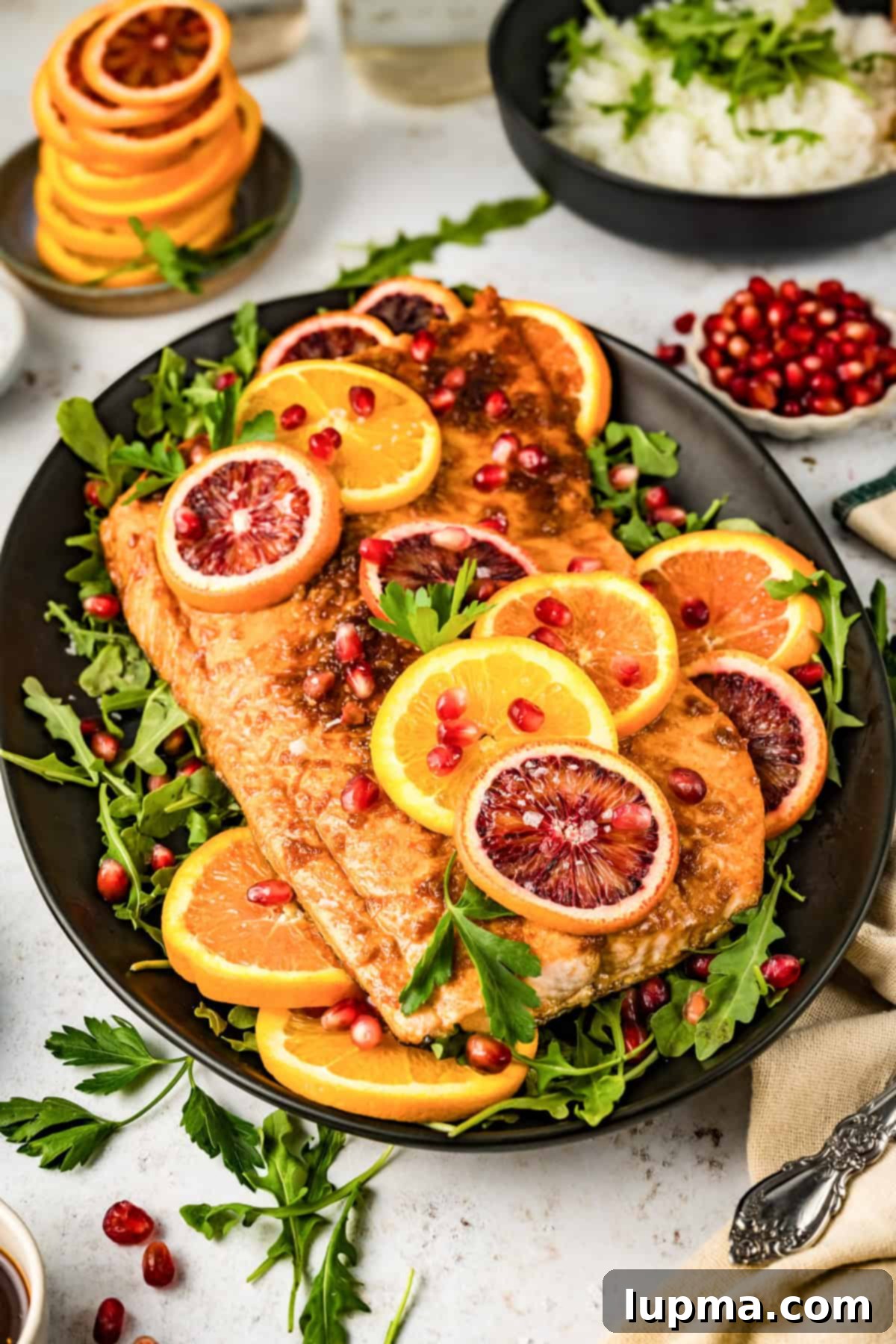 Orange Glazed Salmon served on a black plate 