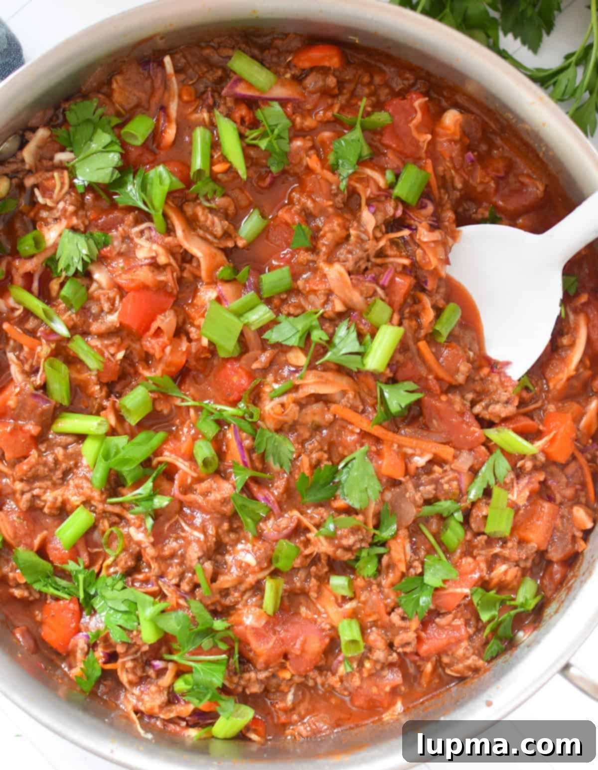 Mediterranean Beef and Cabbage Stir-fry with white spoon 