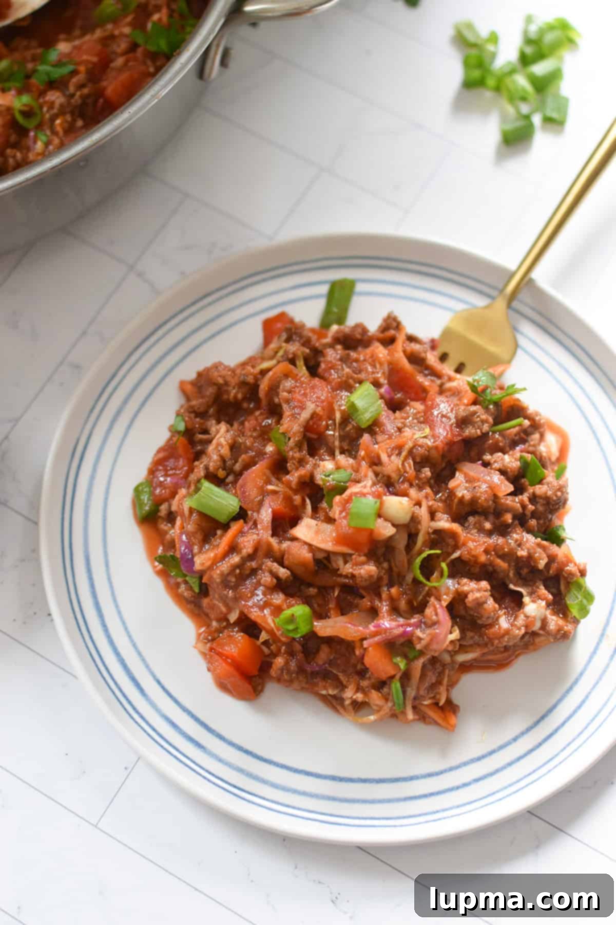 Mediterranean Beef and Cabbage Stir-fry on white plate 