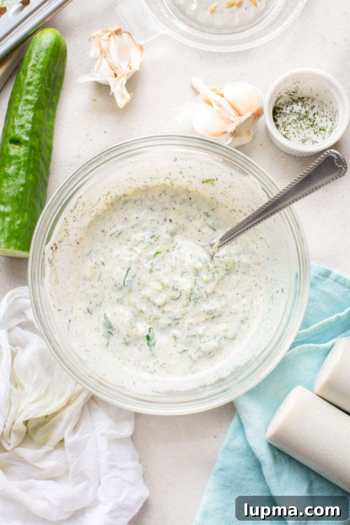 Greek cucumber dip in a bowl with a spoon