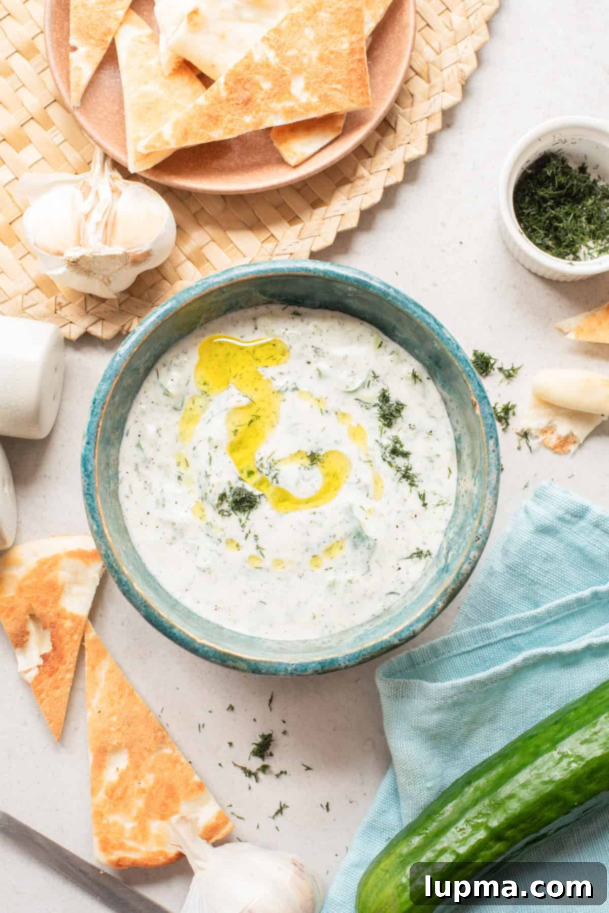 Fresh Cucumber Dill Yogurt Sauce in a blue bowl