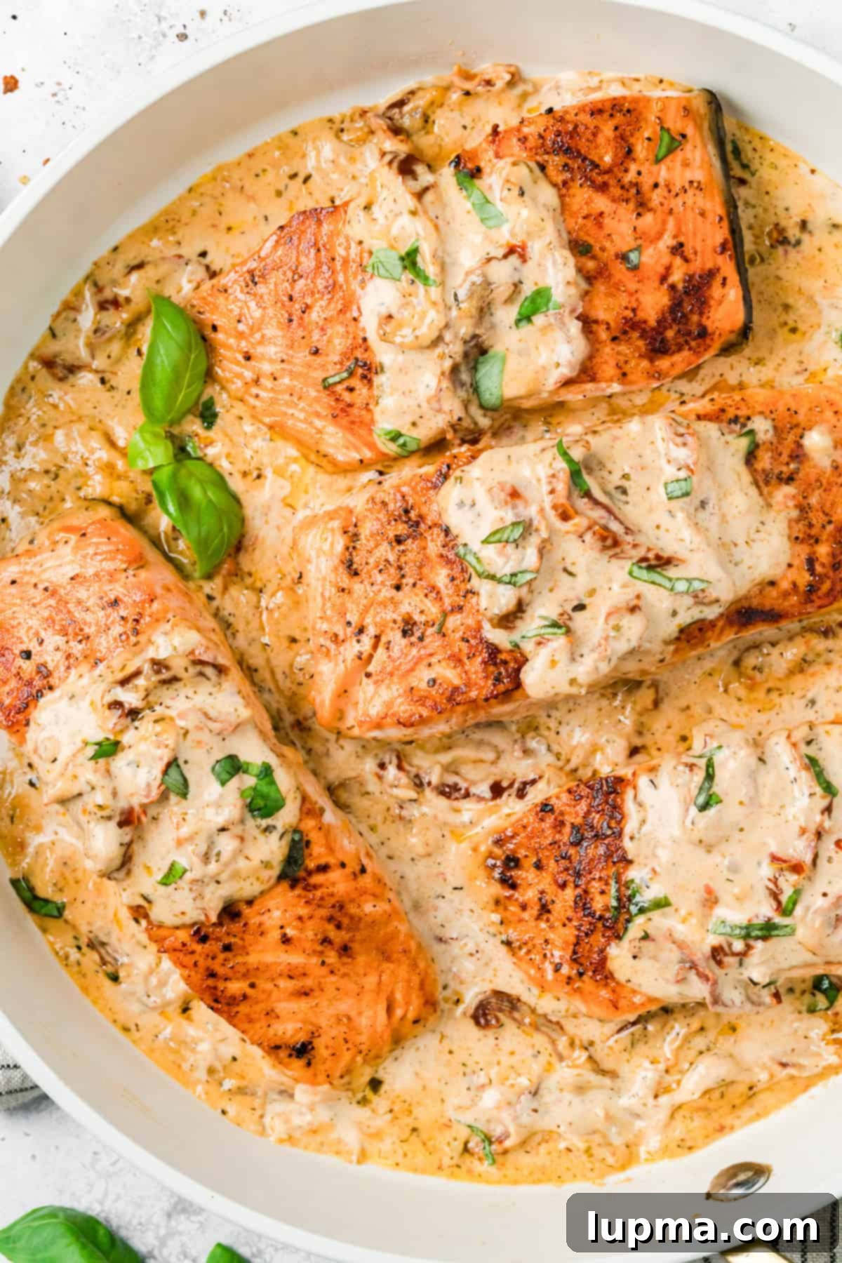 Marry Me Salmon
Forever Entwined Salmon 2 Marry Me Salmon Recipe in a skillet with basil