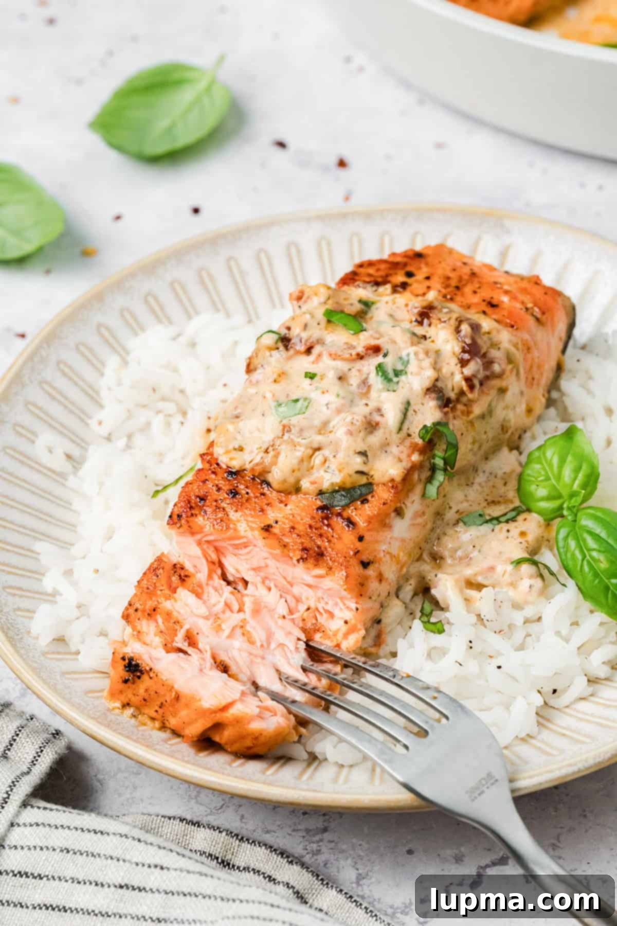 Marry Me Salmon
Forever Entwined Salmon 11 Marry Me Salmon on a plate with a fork flaking the salmon