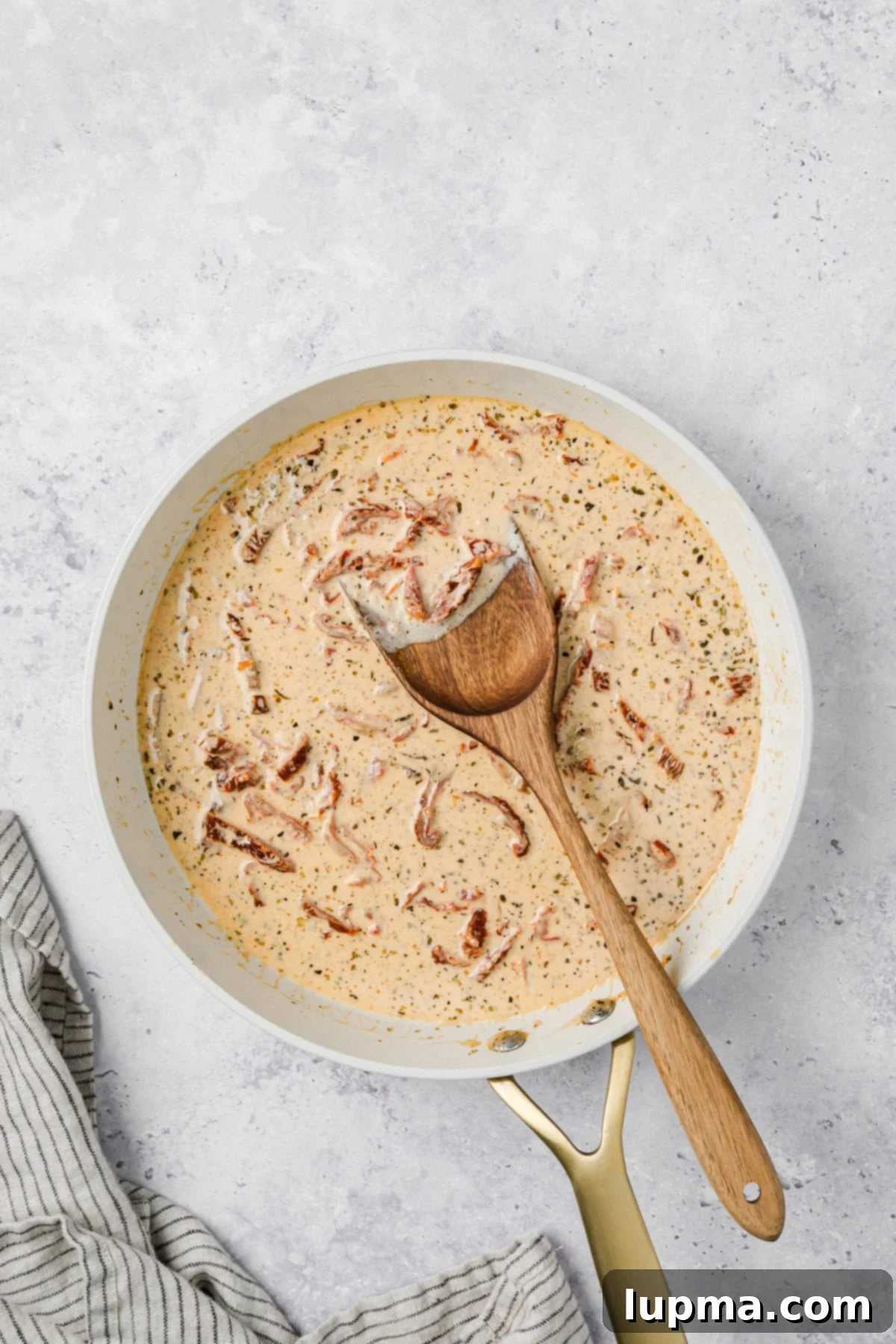 Marry Me Salmon
Forever Entwined Salmon 8 Marry Me Sauce in a skillet with a spoon