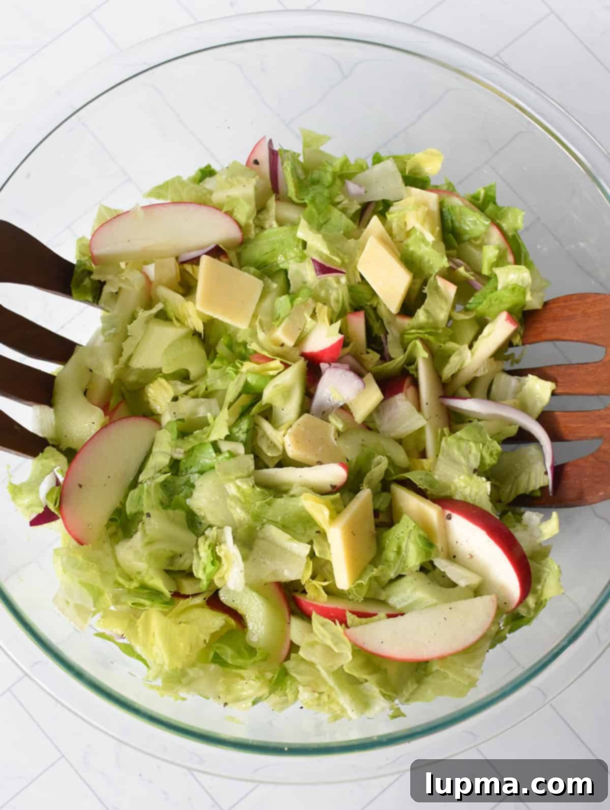 Apple and Celery Crunch: A Refreshing Salad Recipe 8 Easy Apple and Celery Salad mixed in a clear bowl