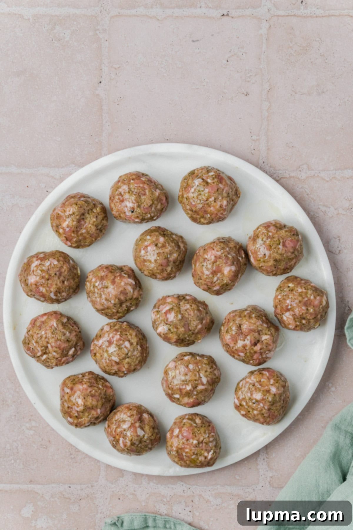 Turkish-Spiced Pesto Turkey Bites 6 Pesto Turkey Meatballs rolled on a plate