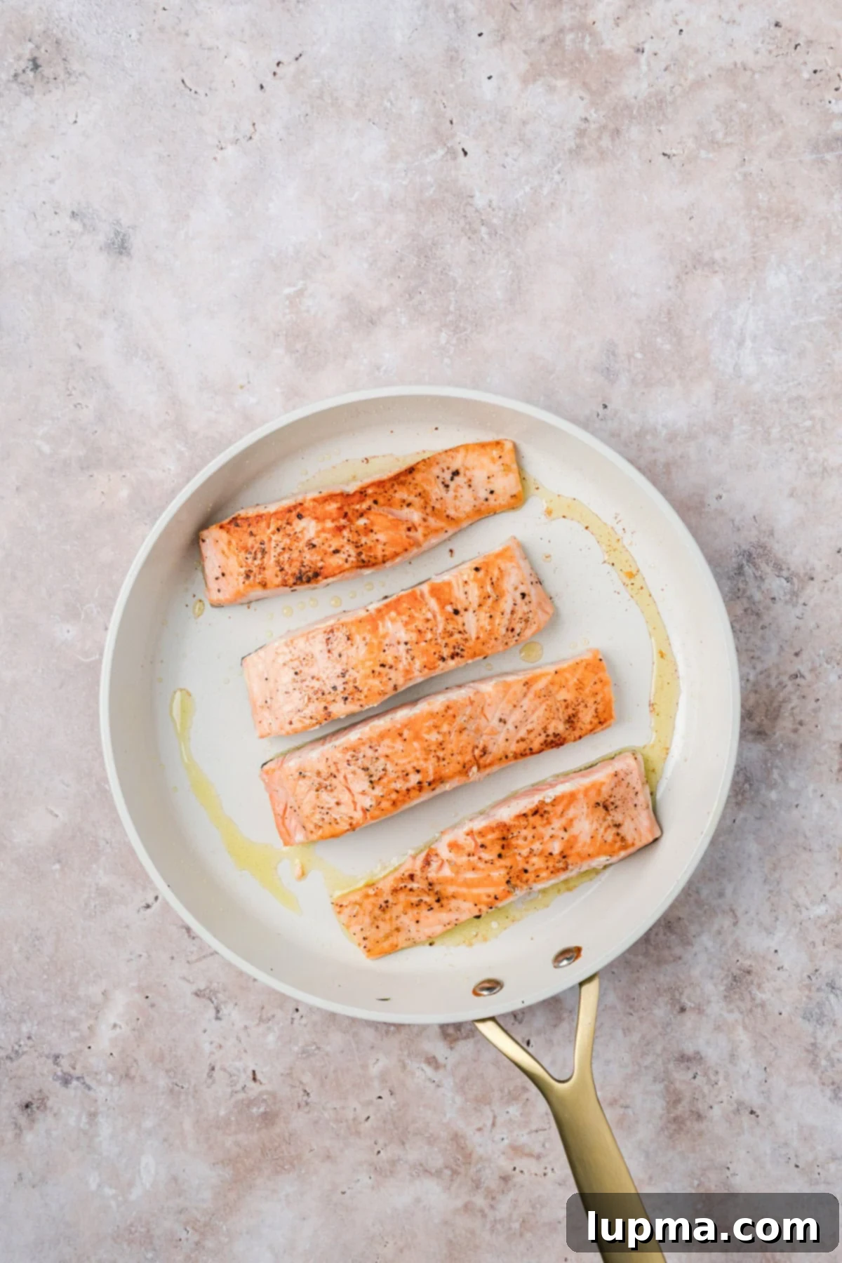 Simple Bourbon Salmon in a skillet 