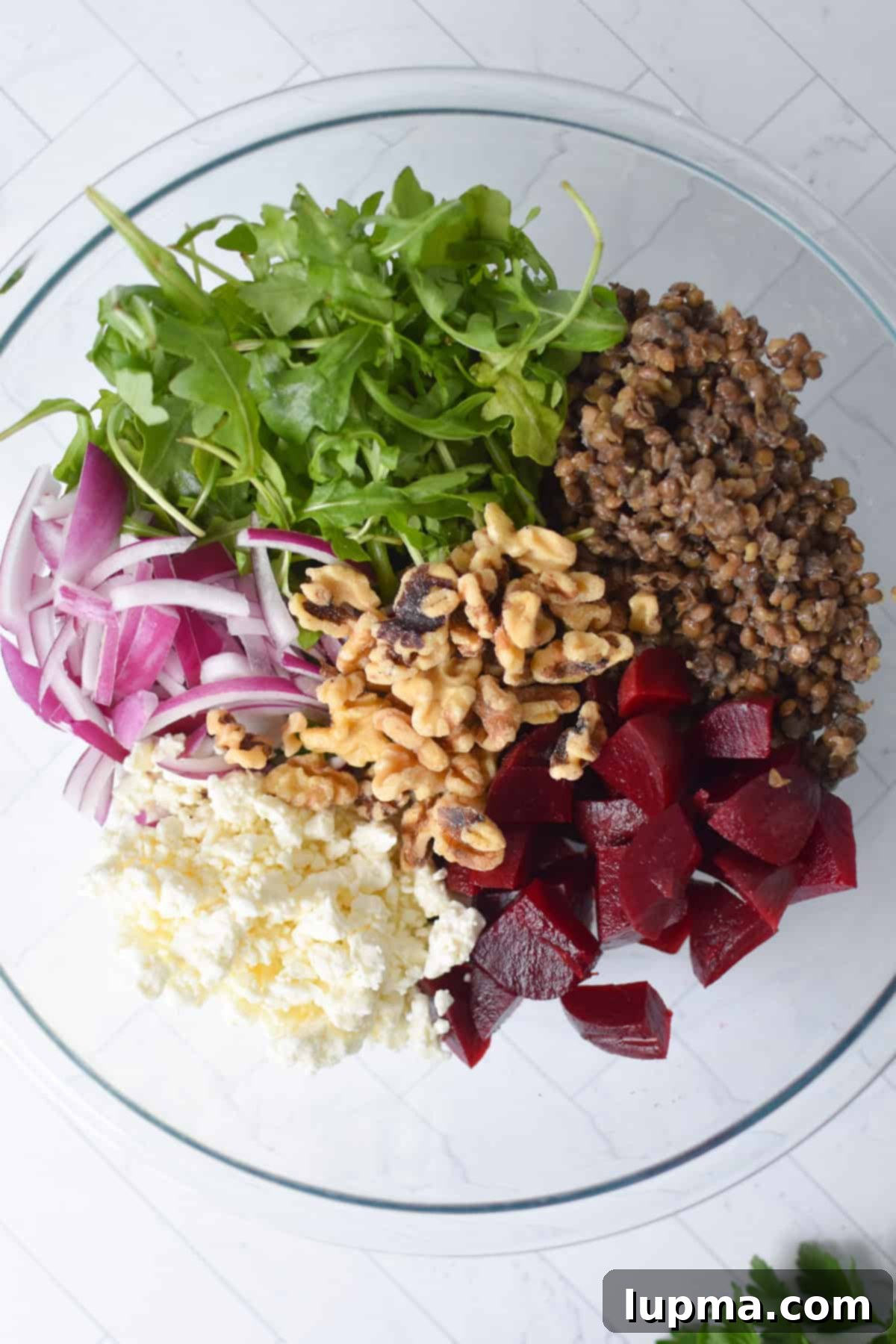 Lentil Salad with Walnuts and Feta ingredients in a clear bowl