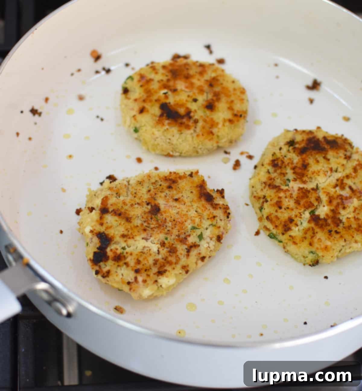 Mediterranean Salmon Cakes recipe in a skillet
