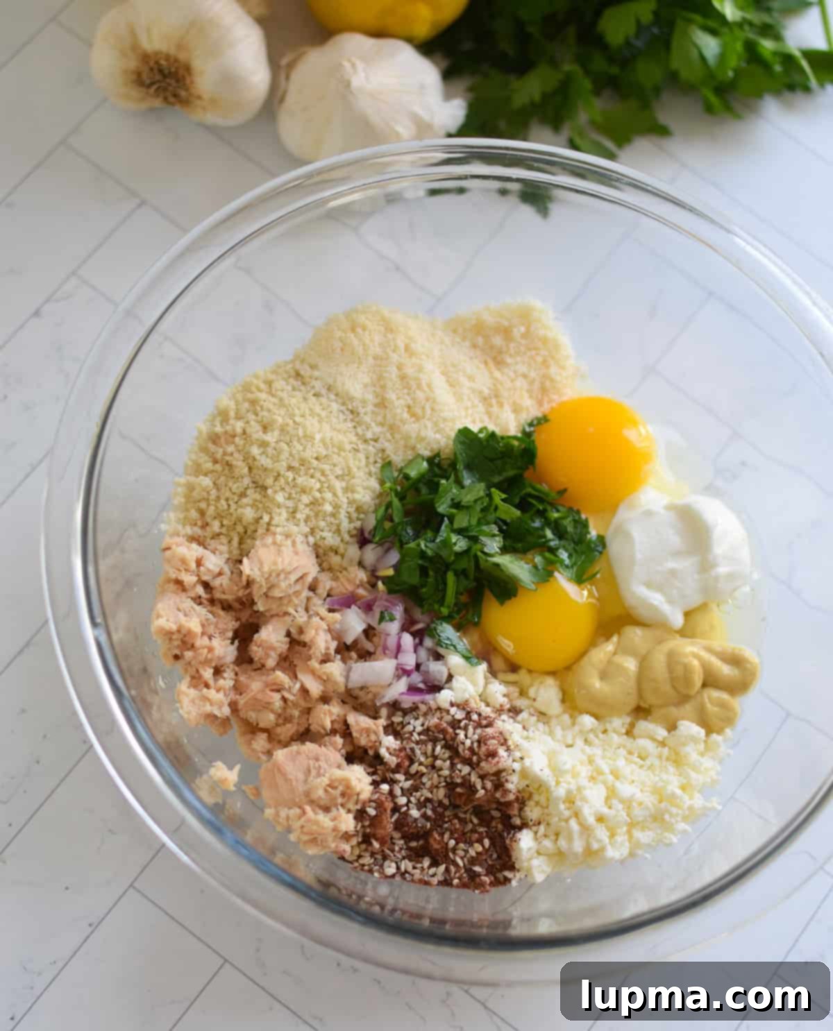 Salmon Cakes Recipe Ingredients in a clear bowl
