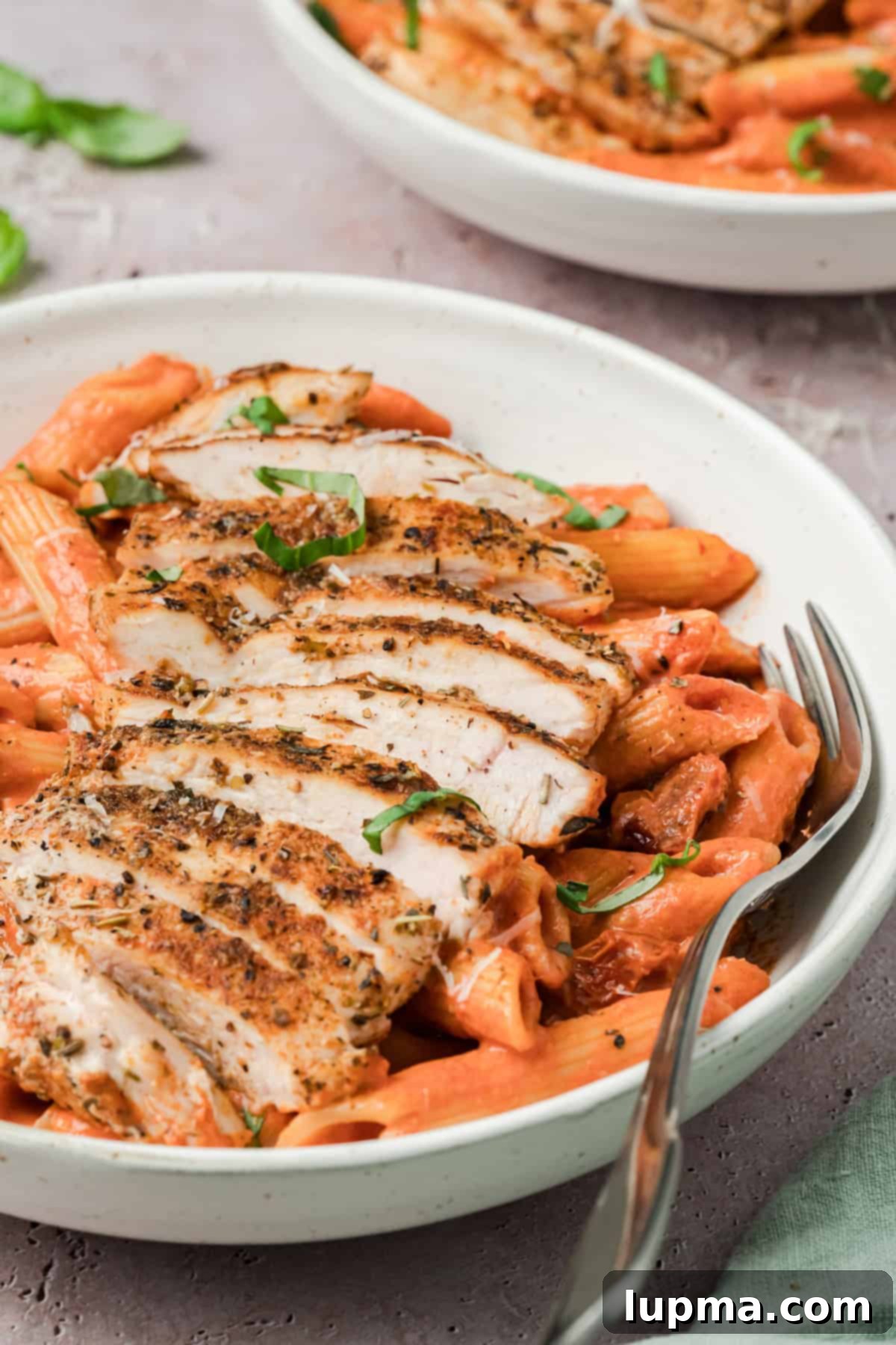 Creamy Tomato Chicken Pasta with Fork