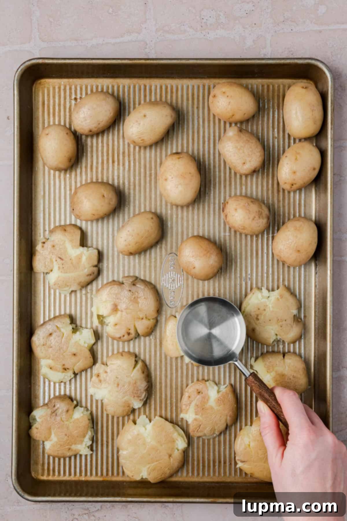 Crispy smashed potatoes topped with parmesan cheese