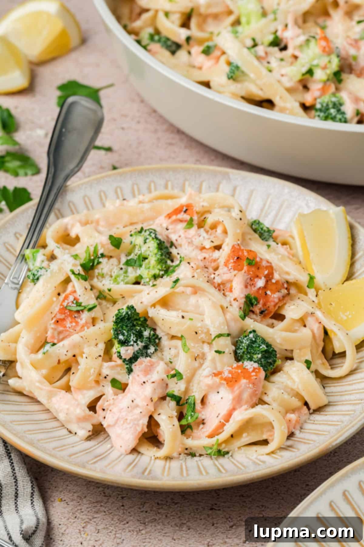 Salmon Alfredo Pasta with tender broccoli and lemon