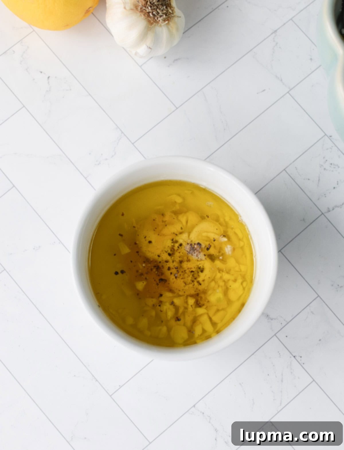 Kale Cabbage Salad with a Tangy Dressing being poured over it