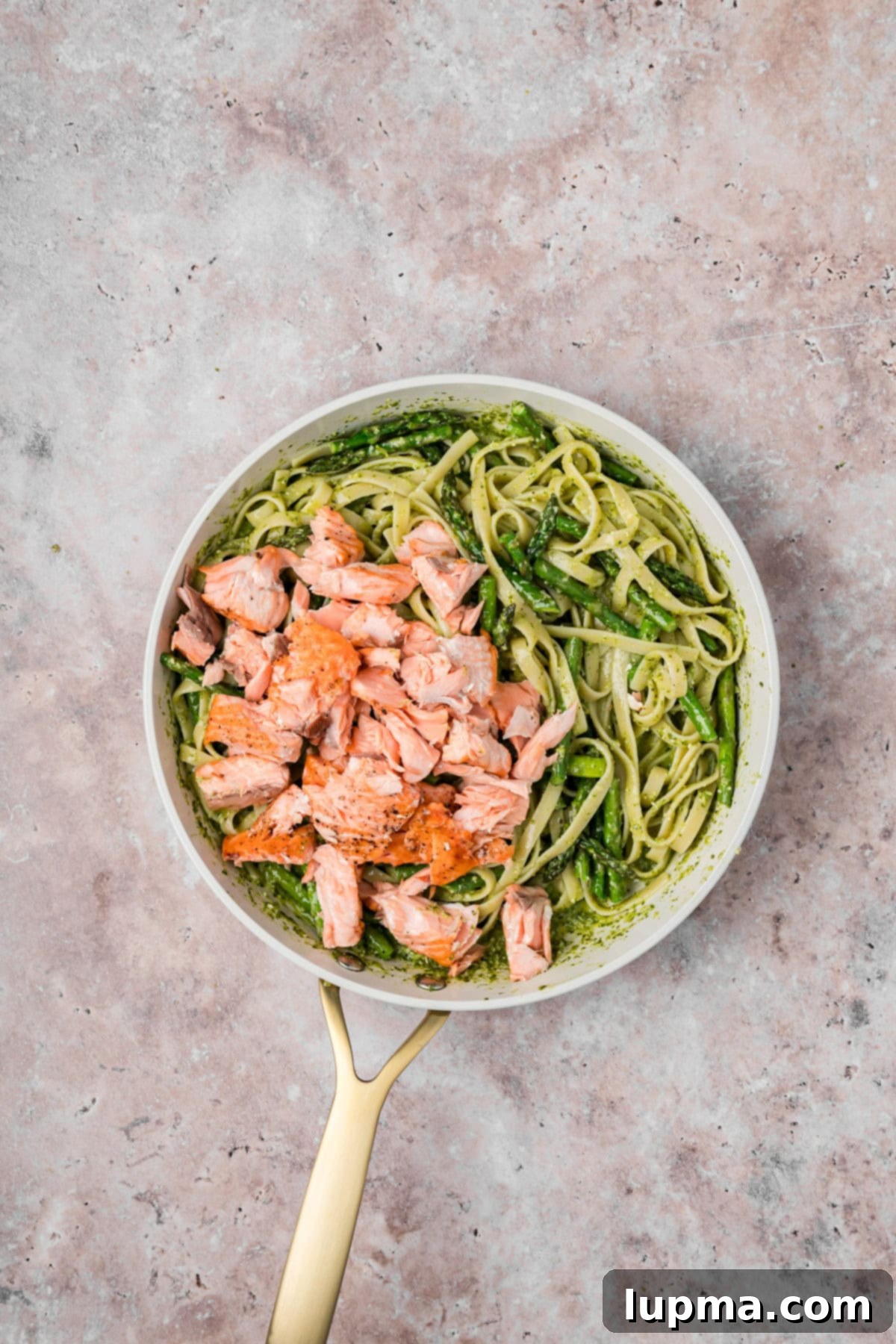Pesto Salmon with Pasta in a skillet