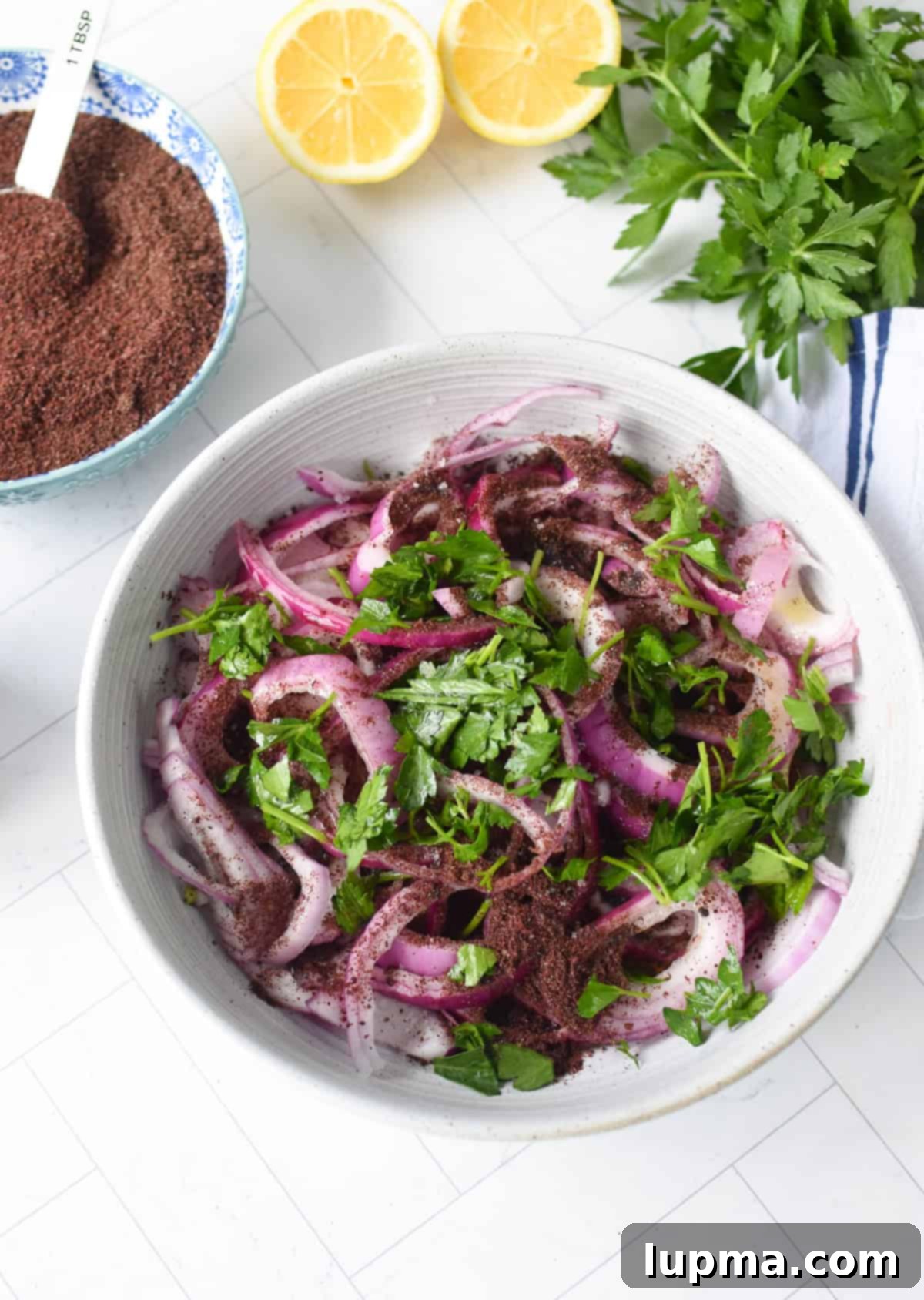 Sumac Red Onions with parsley before massaging 