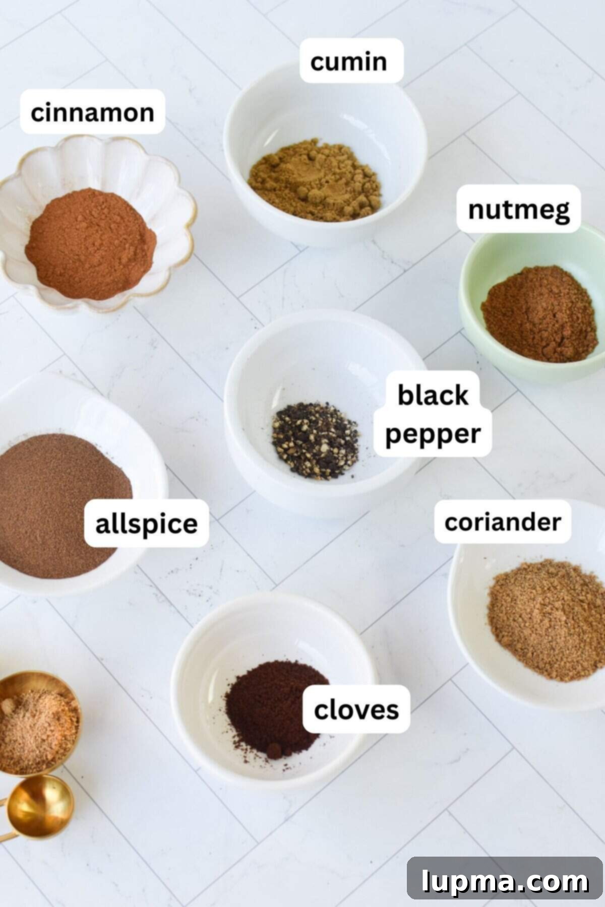 Seven distinct jars of spices for Lebanese 7 Spice blend