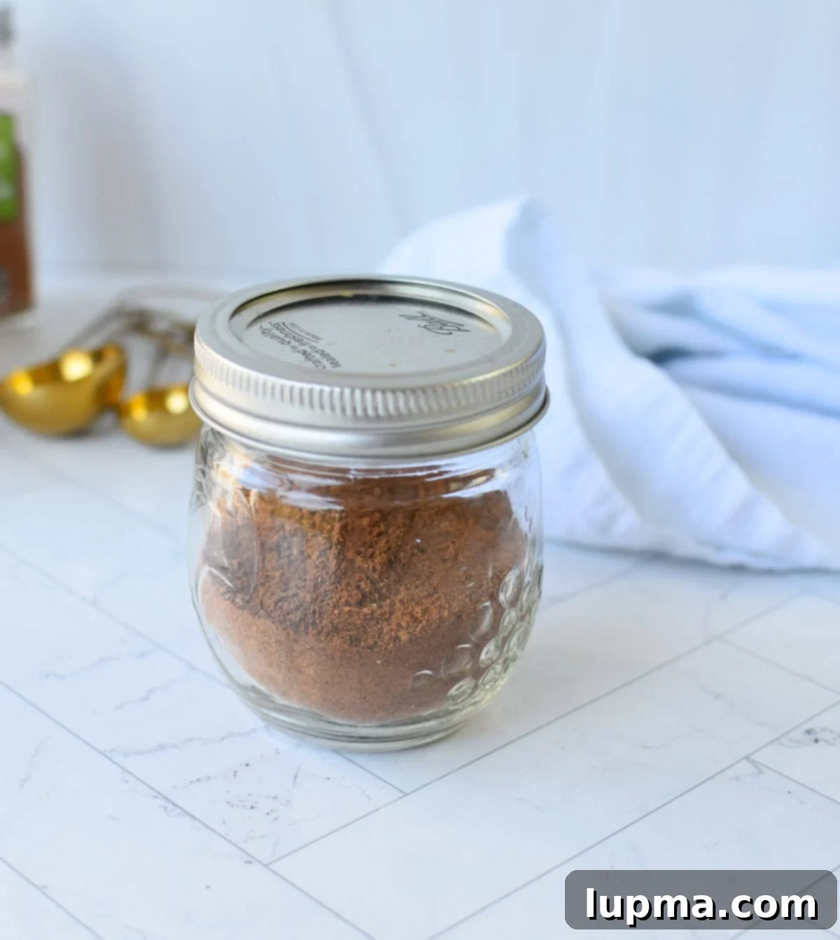 Lebanese Seven Spice Blend (Sabaa Baharat) in a glass jar, better than store-bought