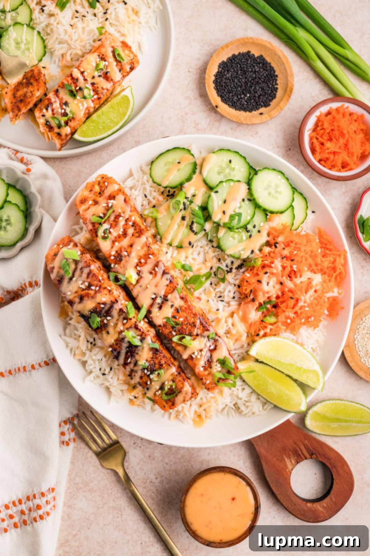 Close up of bang bang salmon fillet showing golden seared crust with creamy orange sauce
