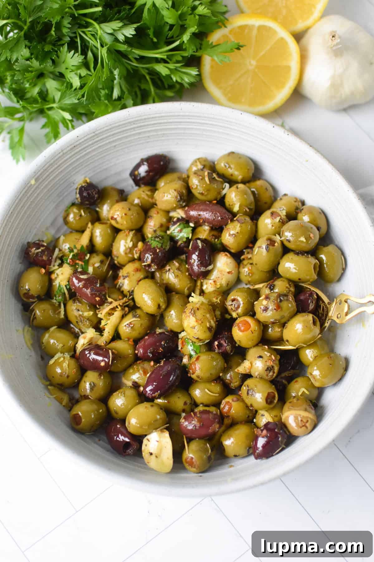 Mediterranean Warm Lemon Olives with Herb Garlic Dip — 10 Minutes 6 Warm olives with lemon and Mediterranean herbs in a white bowl