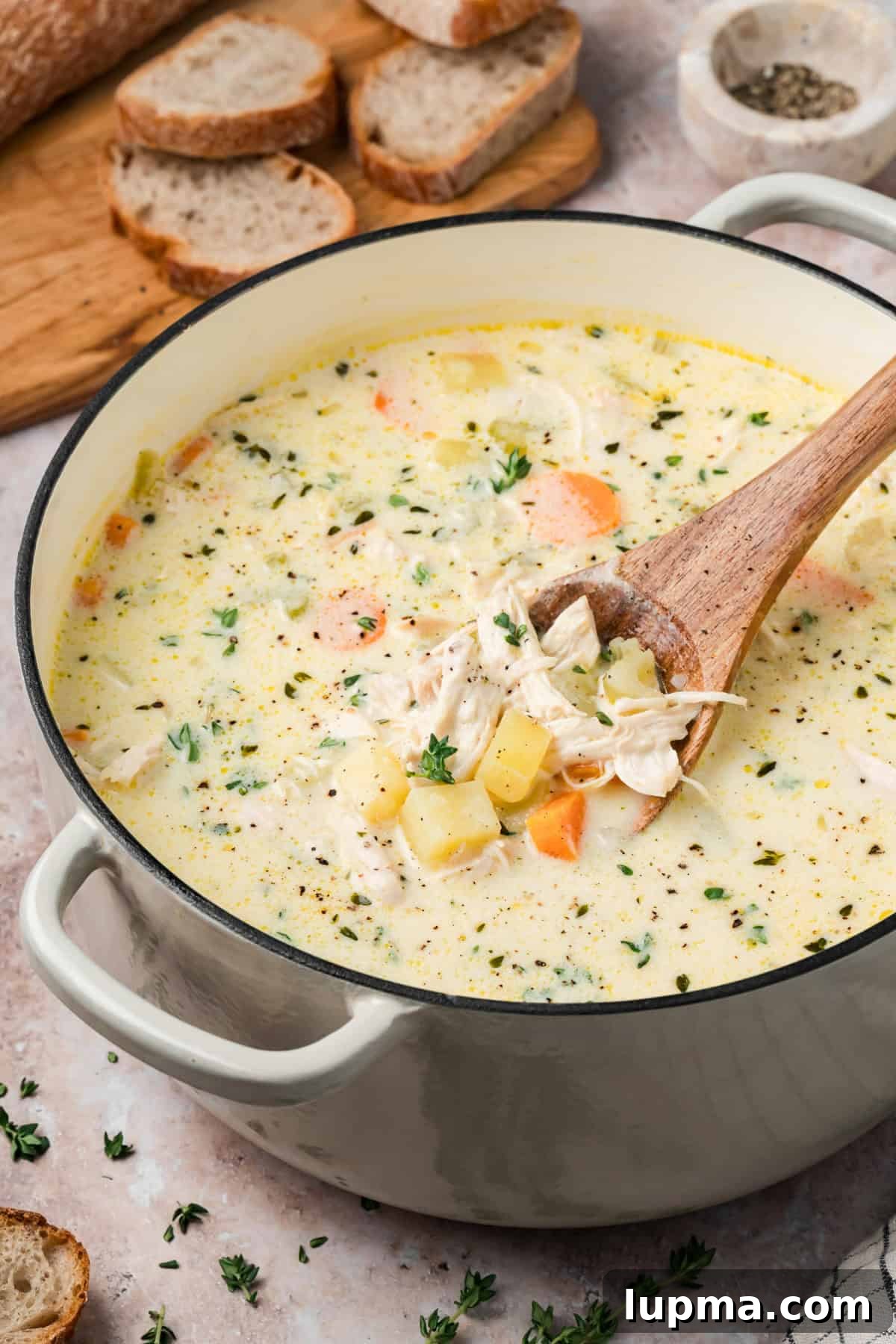 Creamy Chicken and Potato Soup Without Heavy Cream 10 Easy Chicken Potato Soup with a spoon showing chicken