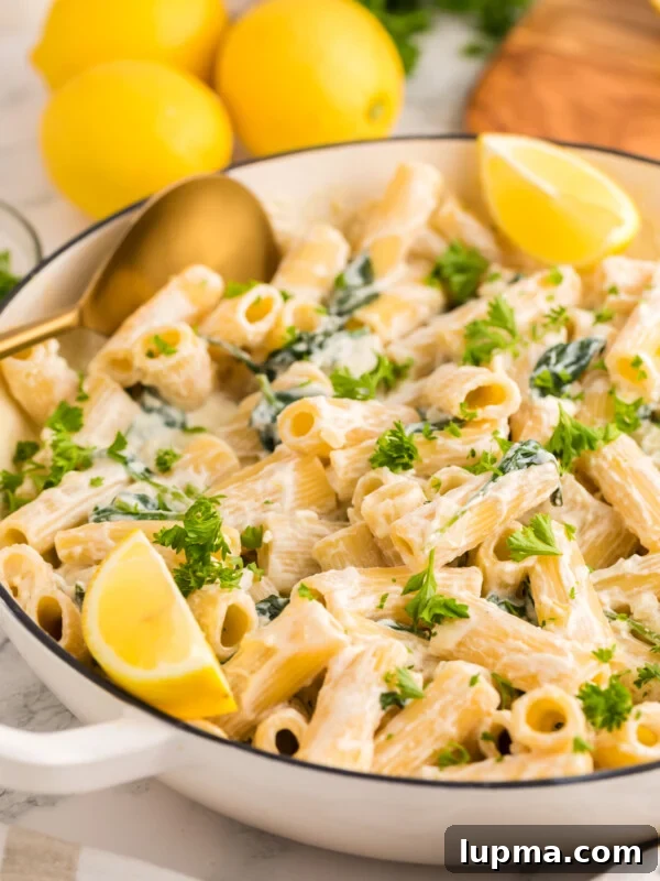 Sausage and Fennel Pasta with Lemon and Parmesan 14 Lemon Ricotta Pasta in a pot with a gold serving spoon.