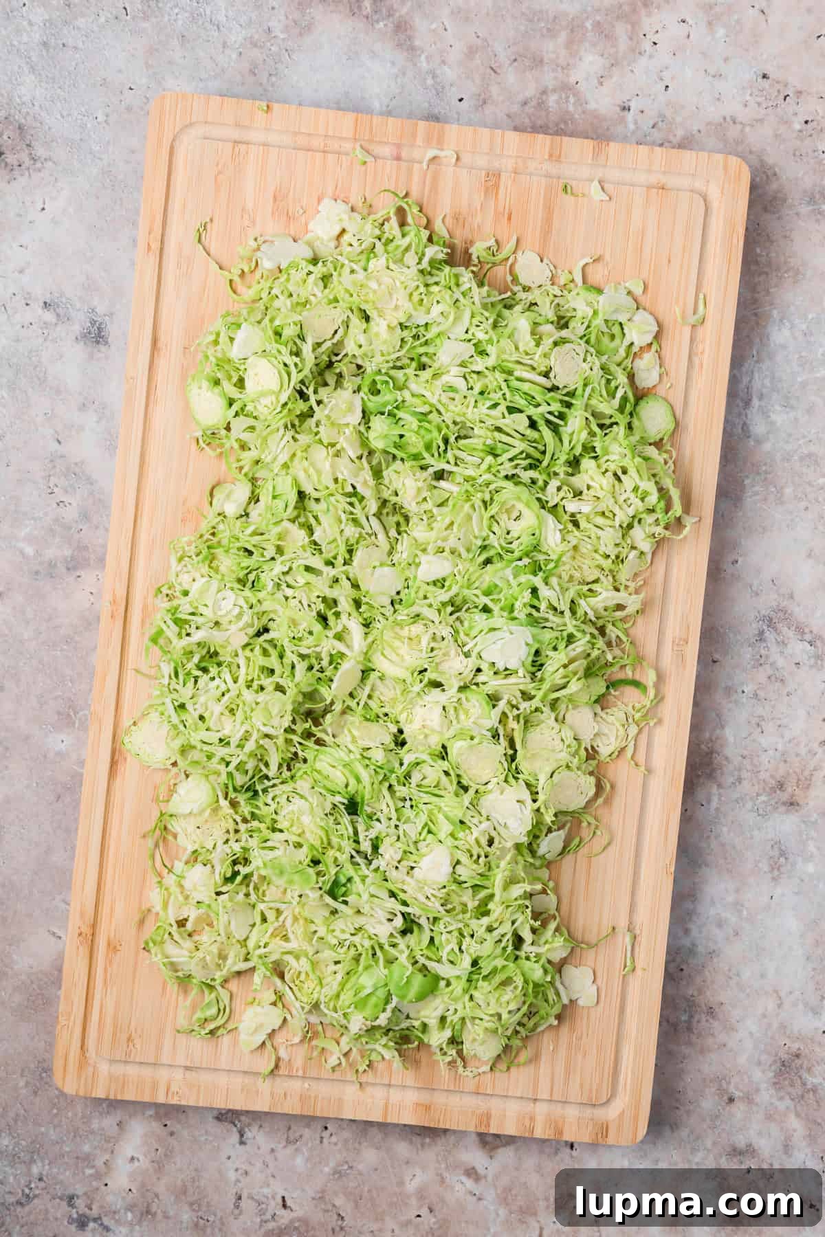 Shaved Brussels Sprouts on a cutting board